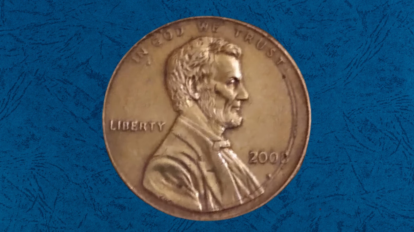 2008 penny double-strike error showing partial second impression of Lincoln portrait offset toward the coin rim