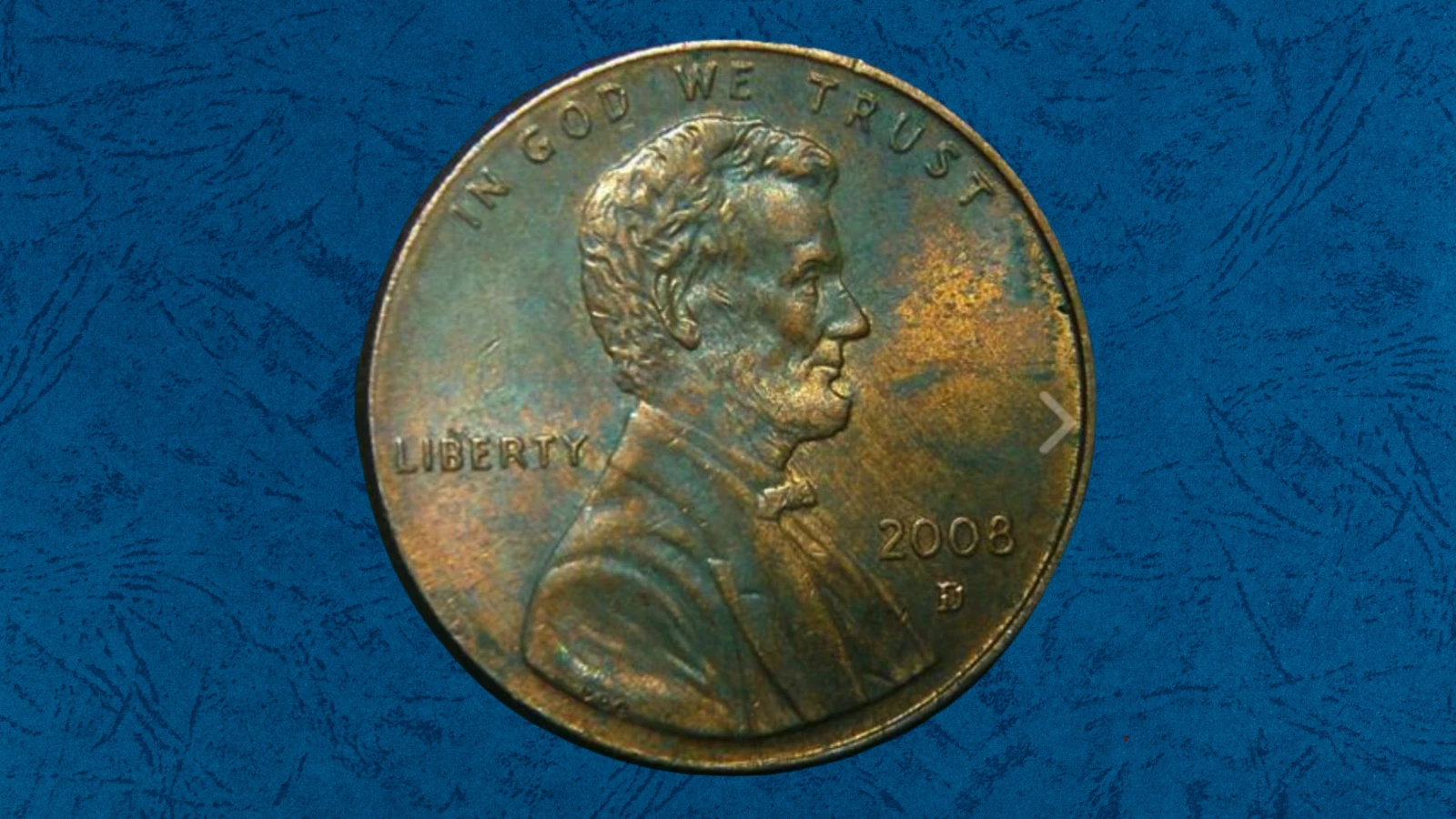 2008 penny off-center strike error showing design offset with blank crescent of planchet visible and full date readable